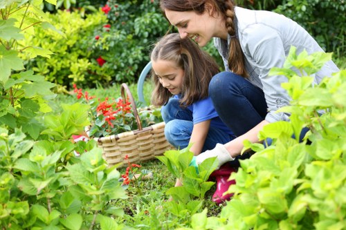 Swiss Cottage gardener sorting green waste for recycling