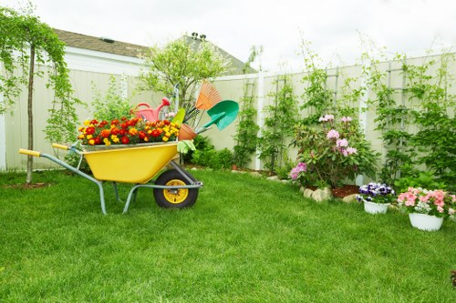 Professional gardener working in a Swiss Cottage garden