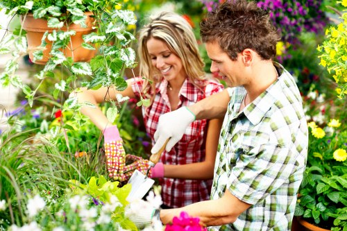 Team of gardeners demonstrating safe planting and working practices